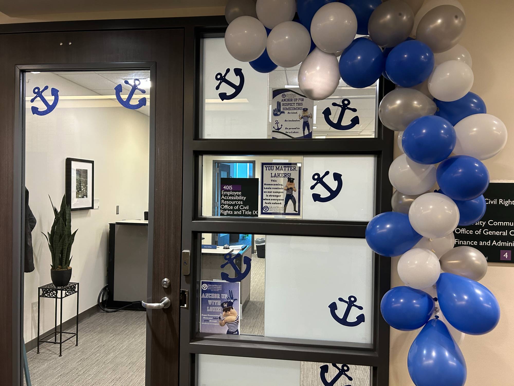 Anchors and a balloon arch frame the OCRTIX door